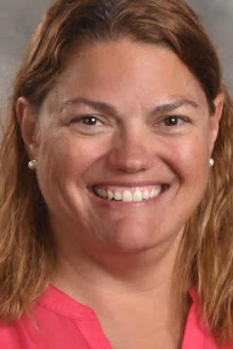 Angela smiling for a photo