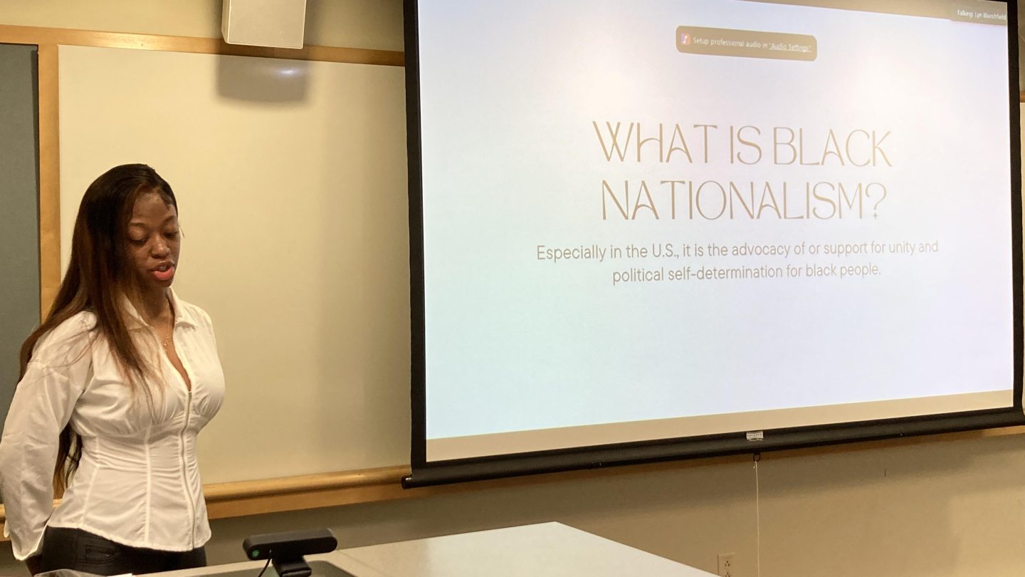 Michelle Thomas giving a presentation at quest 2022