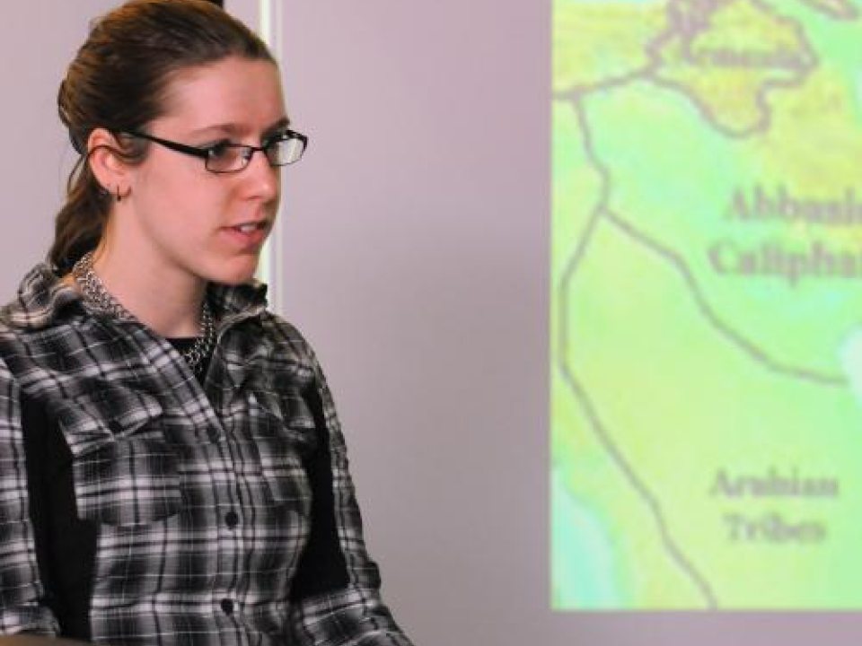 Student giving a presentation to a class