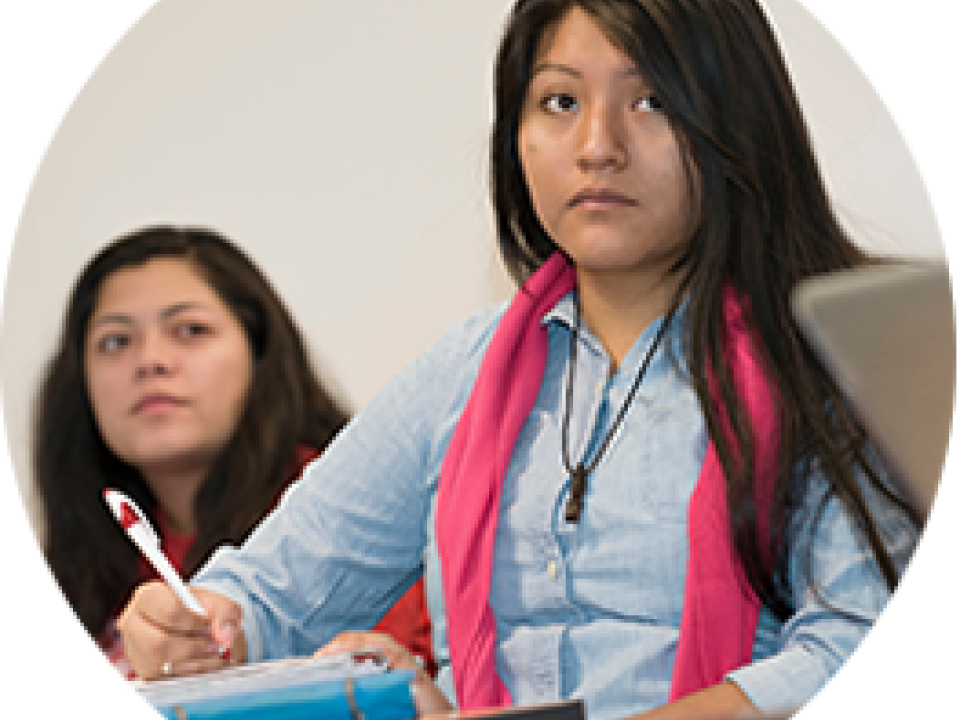 students writing notes in class
