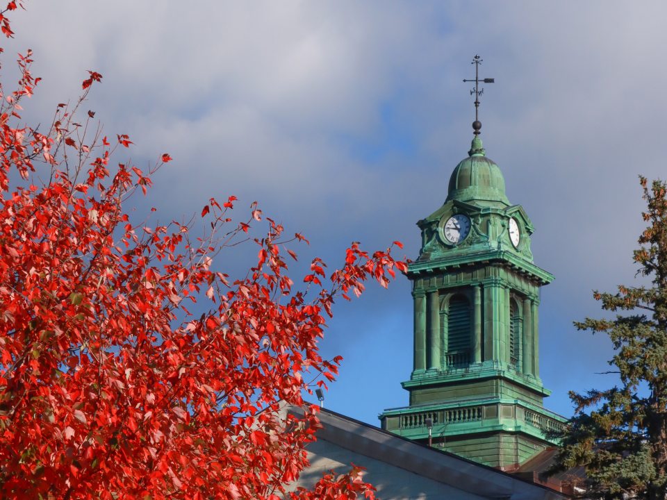 Sheldon Hall cupola pictured with red maple leaves
