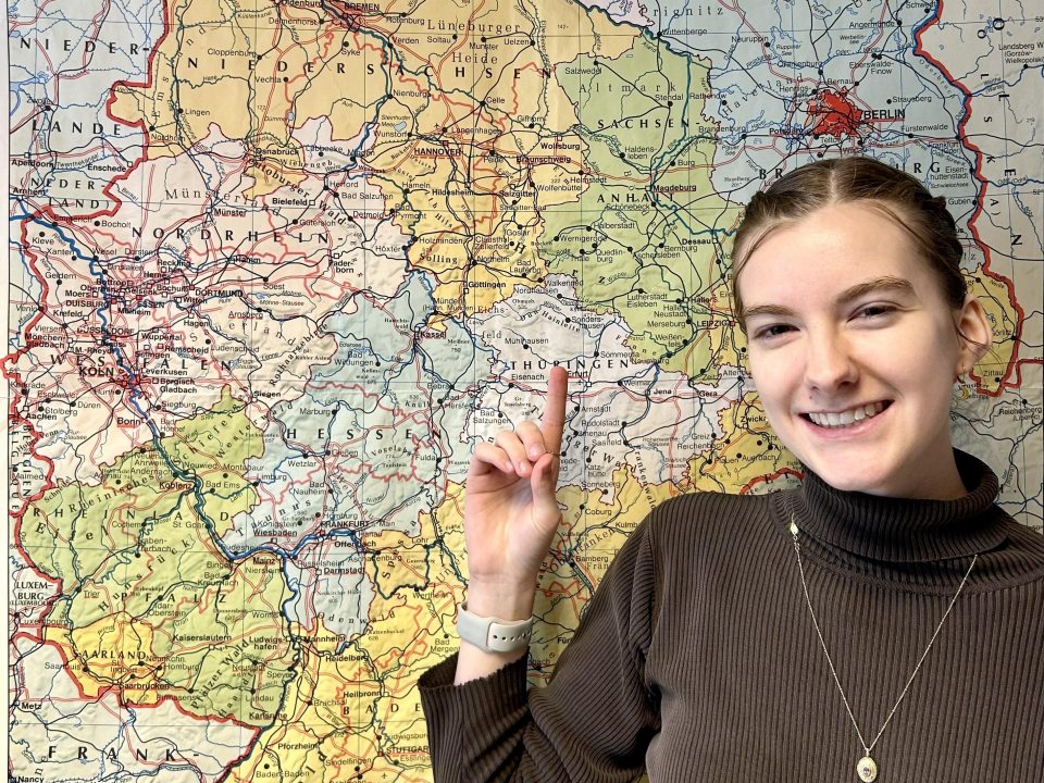SUNY Oswego student smiling outdoors while representing a study abroad opportunity in Germany through an international education grant program.