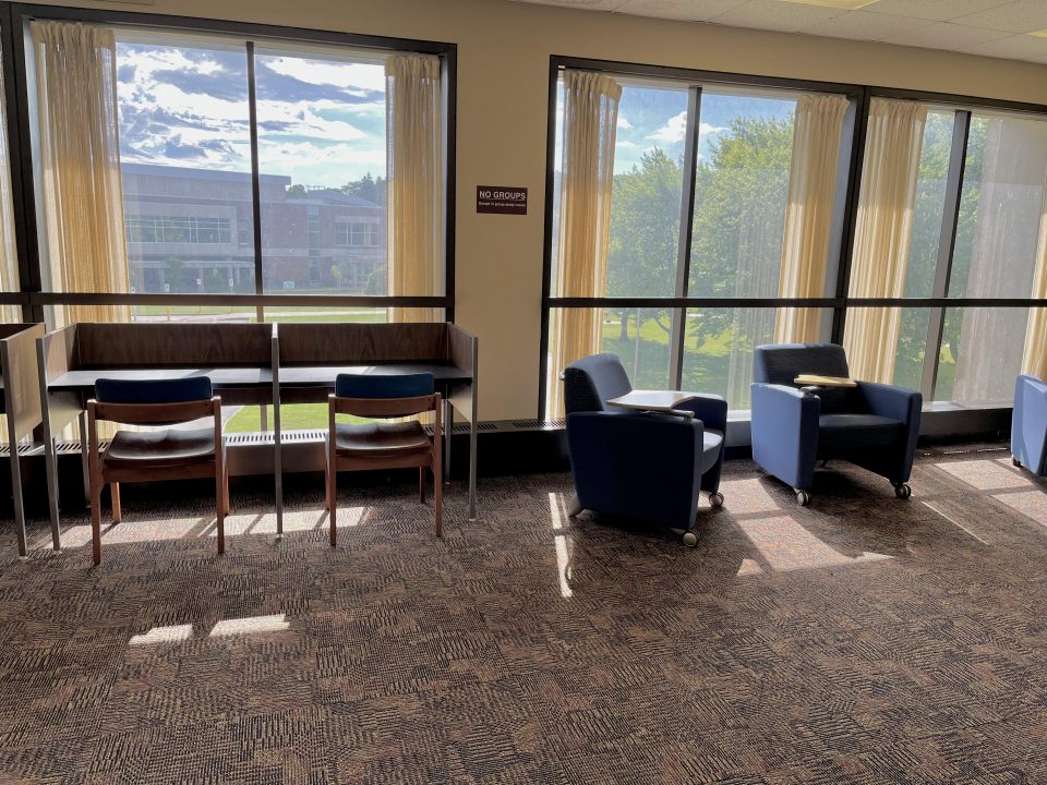 Photograph of tables and chairs on third floor of Penfield 