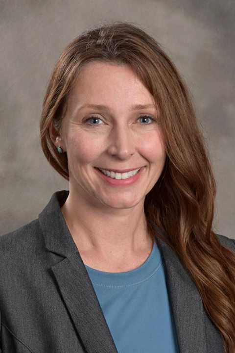 Picture of Sarah Bonzo in blazer against gray background