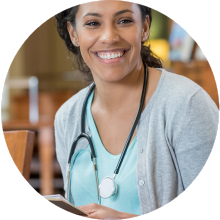  Smiling healthcare professional with a stethoscope.