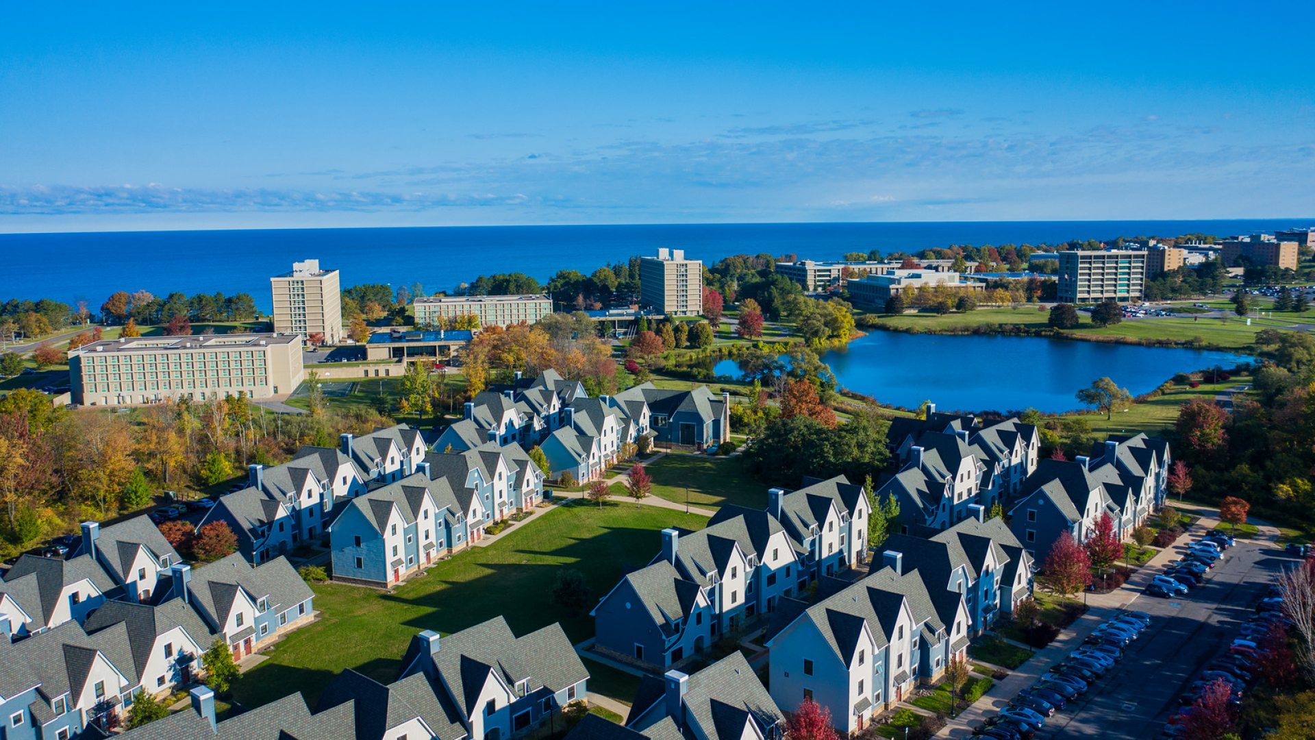 Aerial view of the Village and campus with Lake Ontario in the background