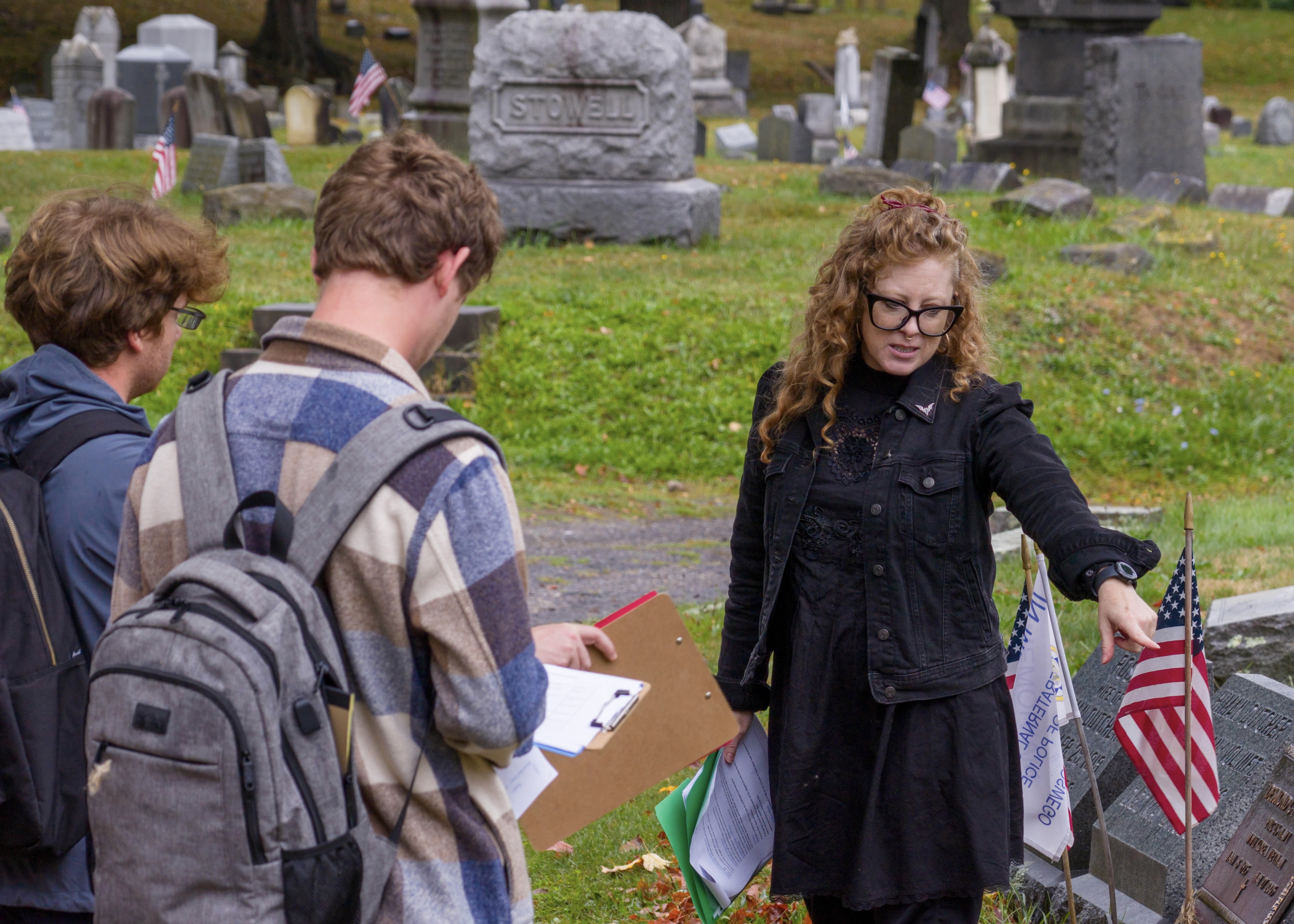 Oswego professor Candis Haak teaches her students in "Death, Data and Local Cemeteries" at the historic Riverside Cemetery in Oswego.
