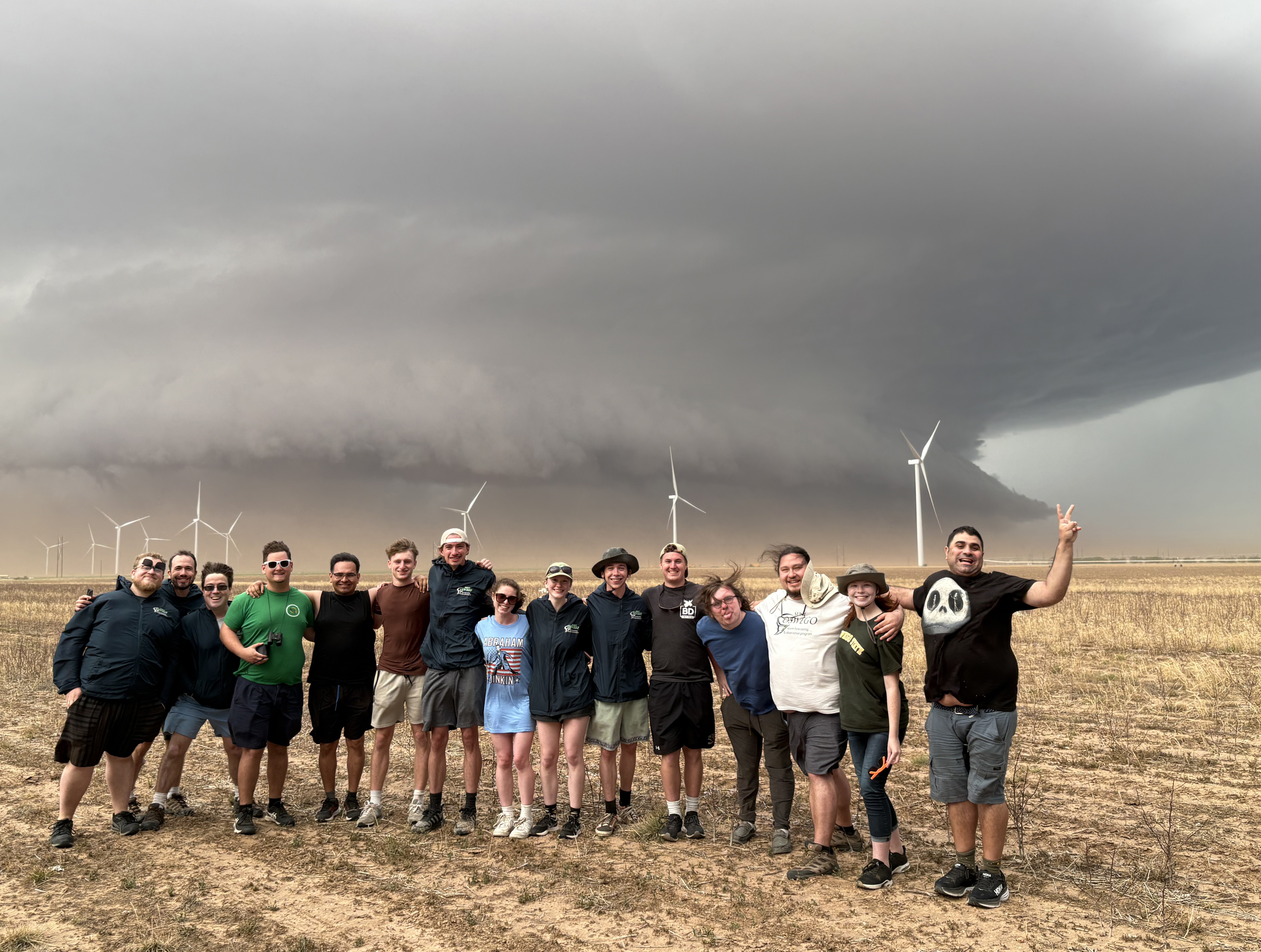 SUNY Oswego storm-chasing students pose (from a safe distance) with a supercell near Tahoka, Texas, on June 6 -- a day they witnessed a rare double tornado. (Photo by Scott Steiger)