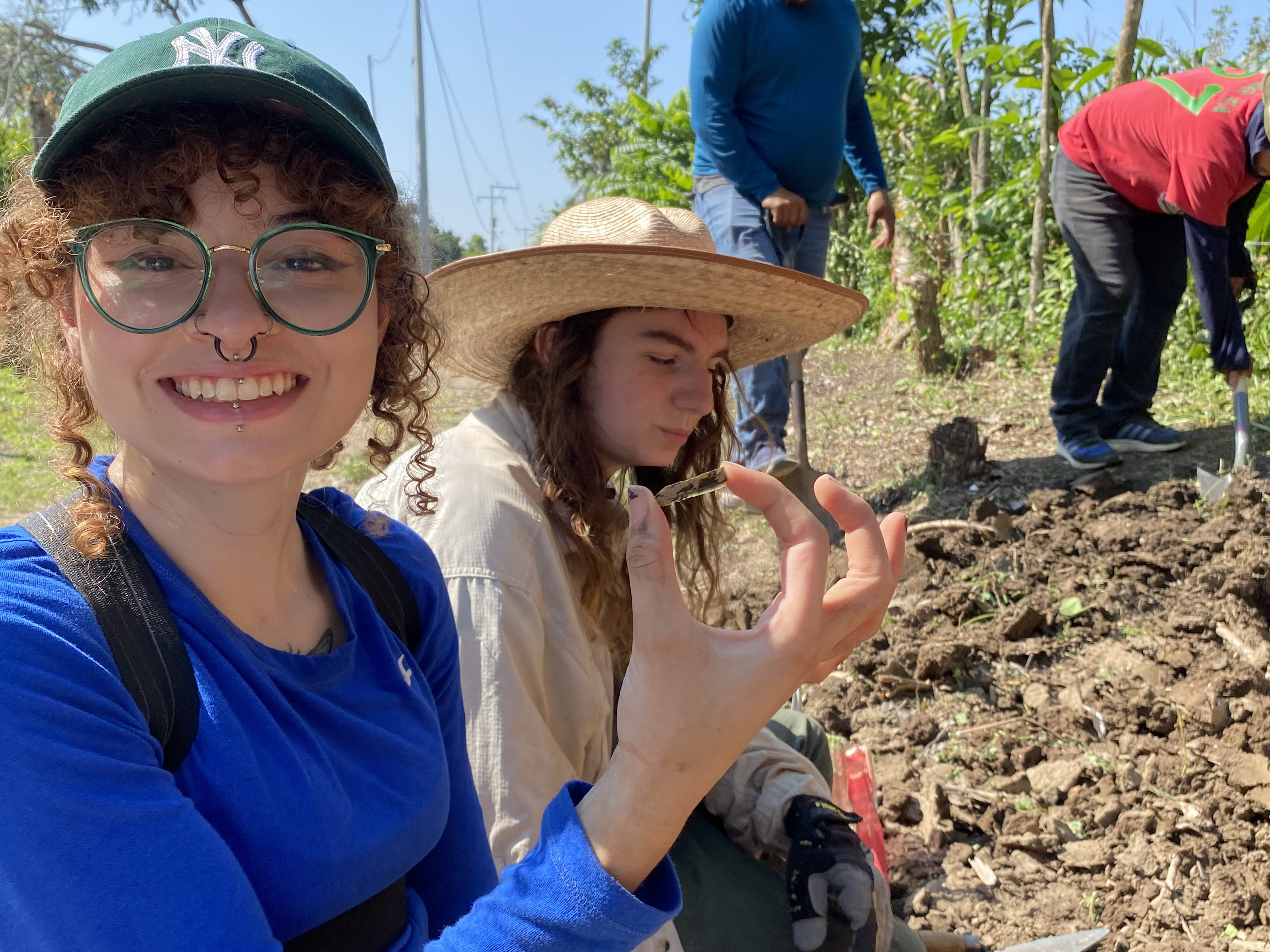 Anthropology major Jylene Figueroa holds up a discovery from a dig earlier this year in Veracruz, Mexico, as part of a National Science Foundation-funded research project.