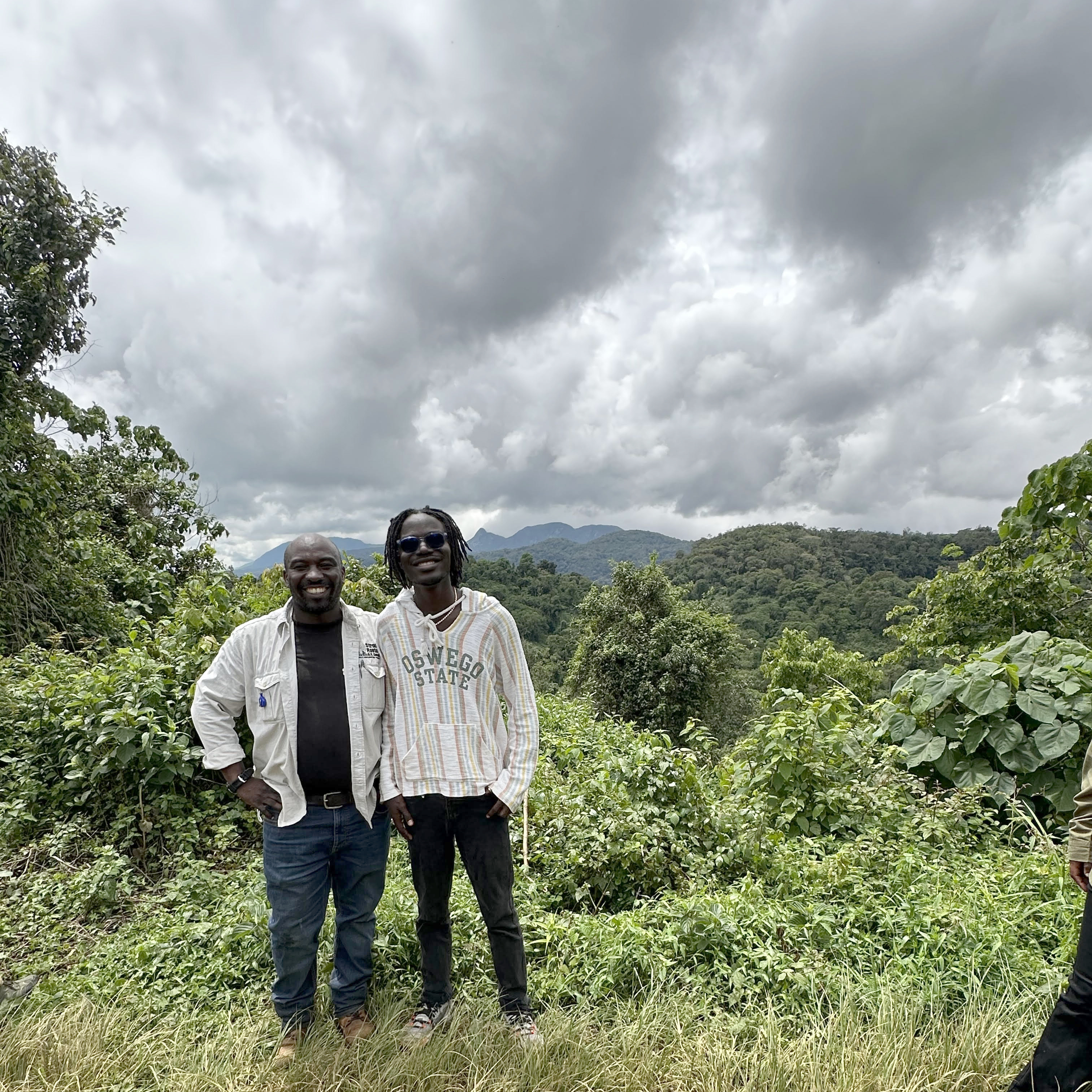 SUNY Oswego student Baye Massene Diallo (right) meets with Dominique Bikaba, the executive director of Strong Roots Congo in Kahuzi-Biega National Park during Diallo's data-gathering research in the Democratic Republic of Congo. Strong Roots Congo, a grassroots conservation and sustainable development organization, helped Diallo meet local leaders and citizens around the park and rainforest, which is one of the most important ecosystems in the world.