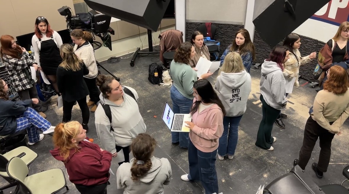 Female students a part of the first ever all-women WTOP sports broadcast speak at their pre-production meeting. Female students a part of the first ever all-women WTOP sports broadcast speak at their pre-production meeting.