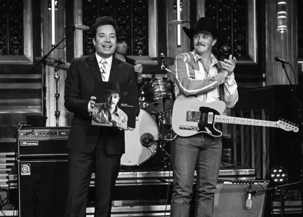 Nate Felty '12 performing on 'The Tonight Show' stage alongside host Jimmy Fallon and country artist Zach Top.