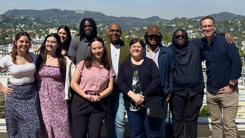 Oswego students and faculty stand in front of the Hollywood sign on their Hollywood POV trip.