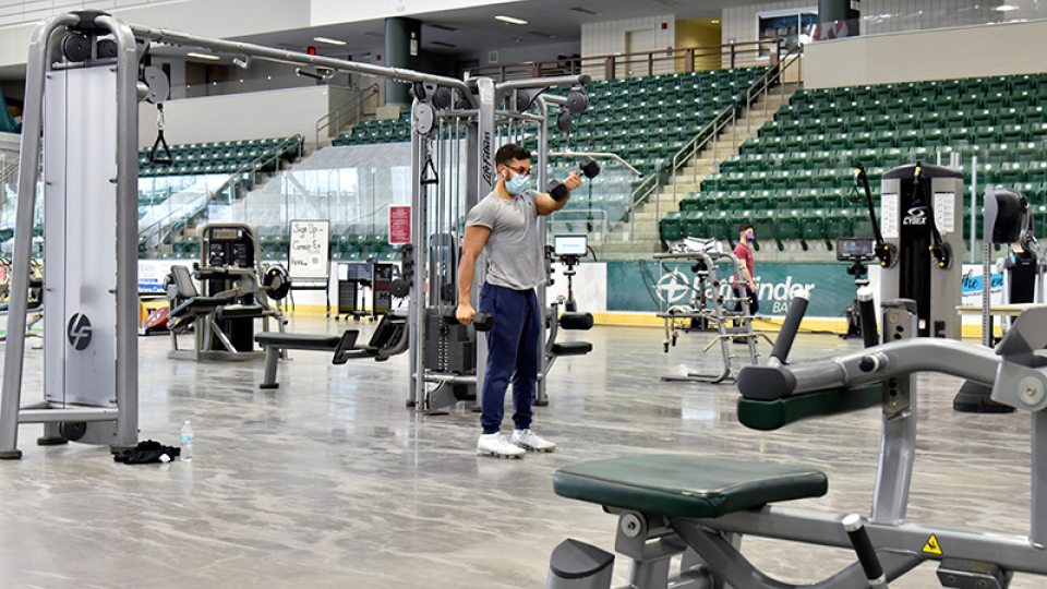 Students use the Fitness Centers relocated into Marano Campus Center arena