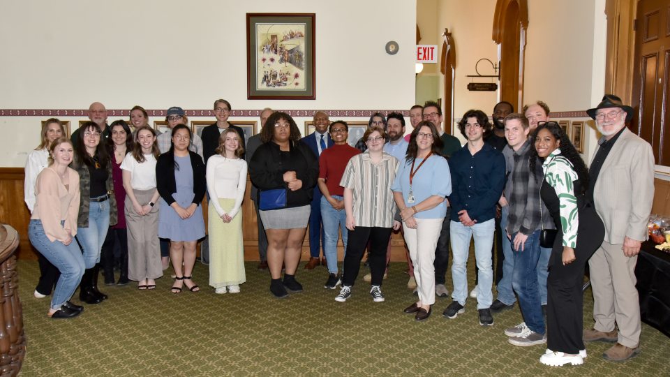 Participants and partners in the campus-community initiative ‘One City. One Campus. One Community’ gather at a May 1 reception in Oswego's City Hall
