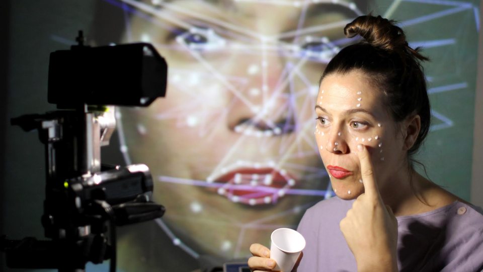 Mutlimedia performer Anna Oxygen works with eye tracking software in building a 3D creation