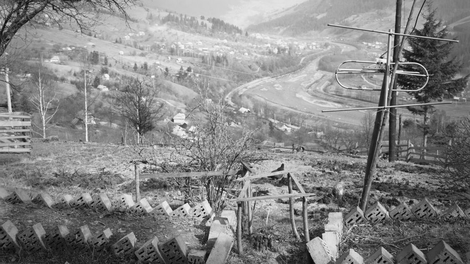 Black and white photo of an antenna upon a hill in Ukraine