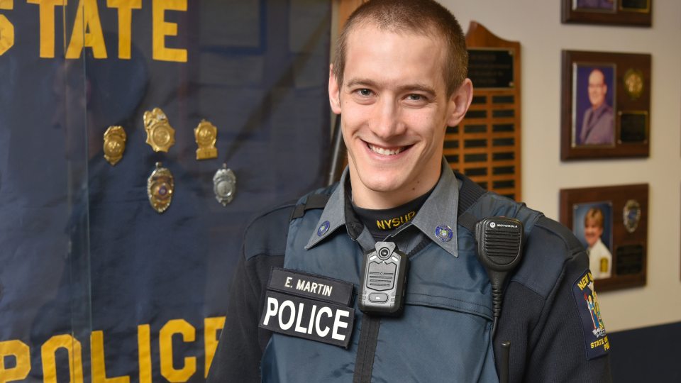University Police Officer Eric Martin showing body-worn camera