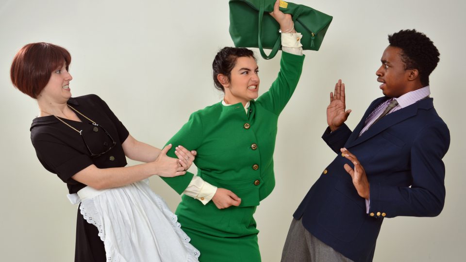 Rehearsal scene of lover being held back by maid from man who is cheating on her