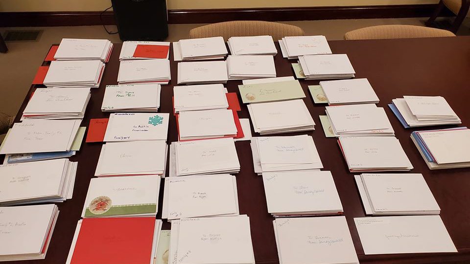 A table full of cards for those impacted by mass shootings