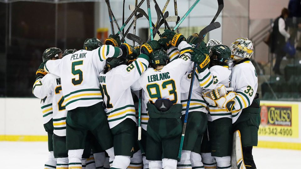 Laker men's hockey players celebrate a win
