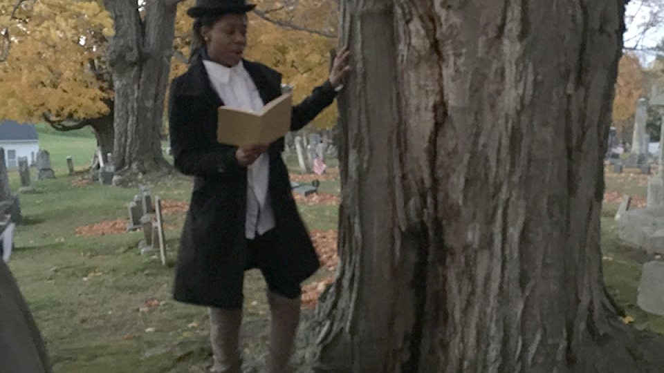 A student dressed in historical clothing telling a story