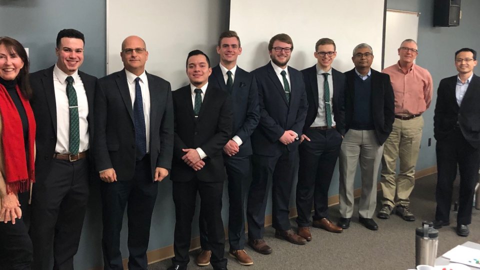 Winning CFA competition student team with supporters
