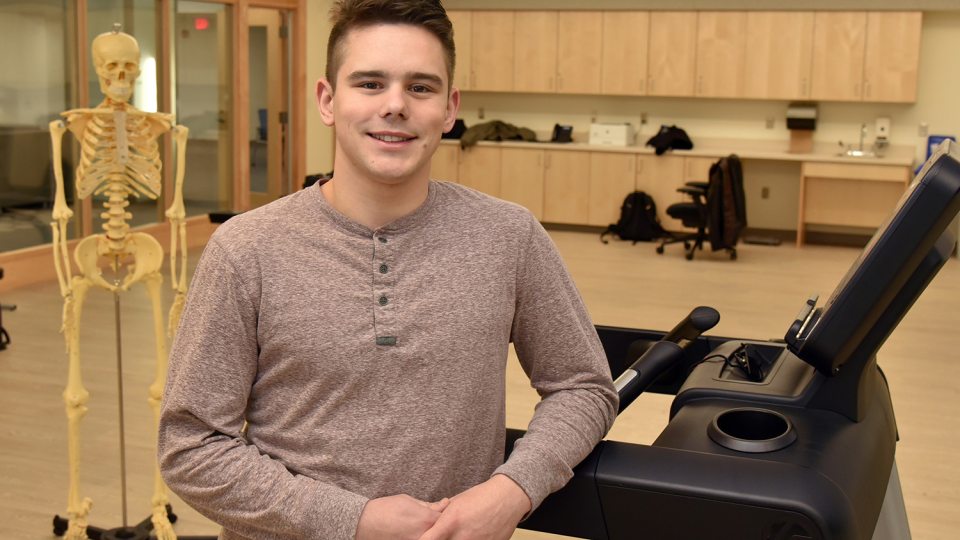 Student Maxim Kutepov in new laboratory of department of health promotion and wellness in Wilber Hall