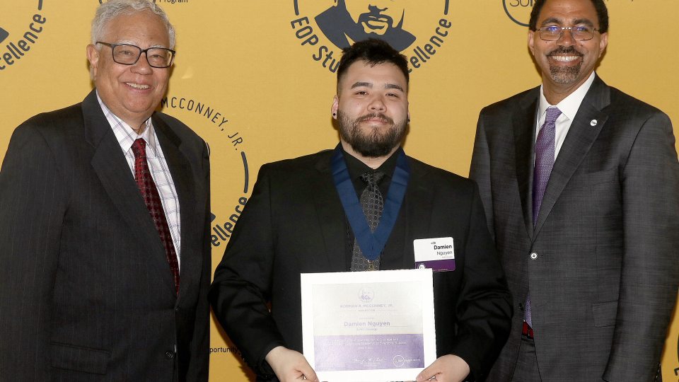 Damien Nguyen receives congratulations for his EOP award