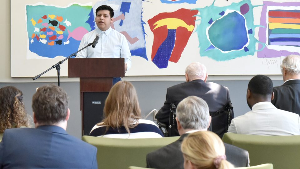Shown speaking at the May dedication of SUNY Oswego's Maraviglia Atrium, Bryan Diaz-Ximello was one of five 2023-24 winners of the Carey Gabay Scholarship Program