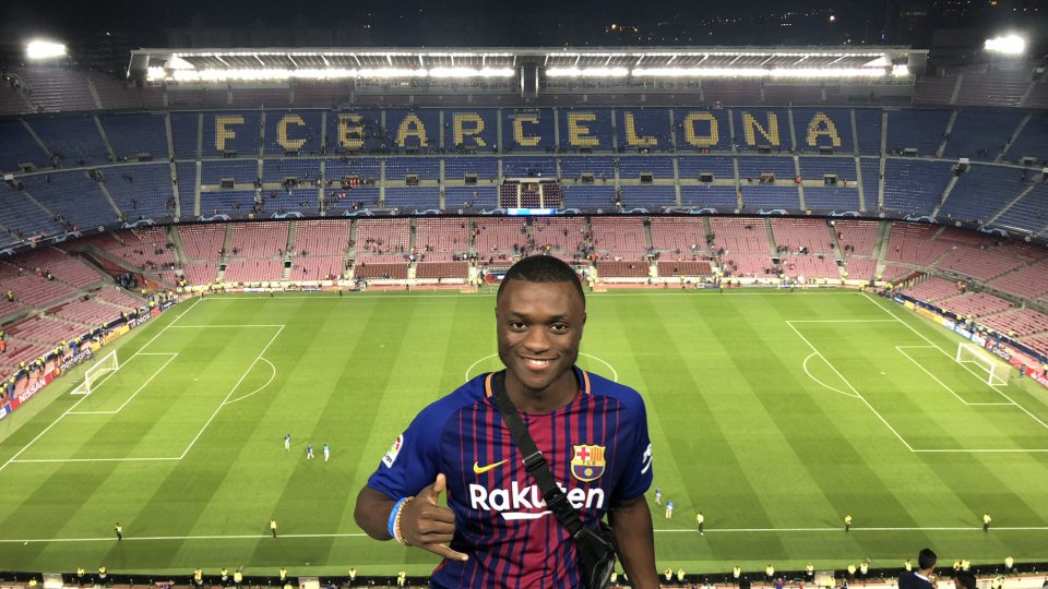 Nyezee Goe prepares to enjoy an FC Barcelona soccer match in Spain while on his study abroad exploration