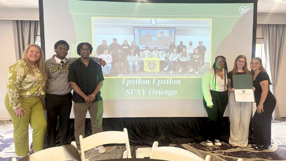 SUNY Oswego representatives celebrate national chapter award