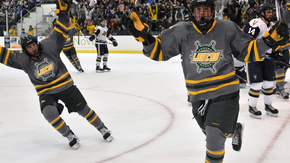 Laker men's hockey players celebrate a goal