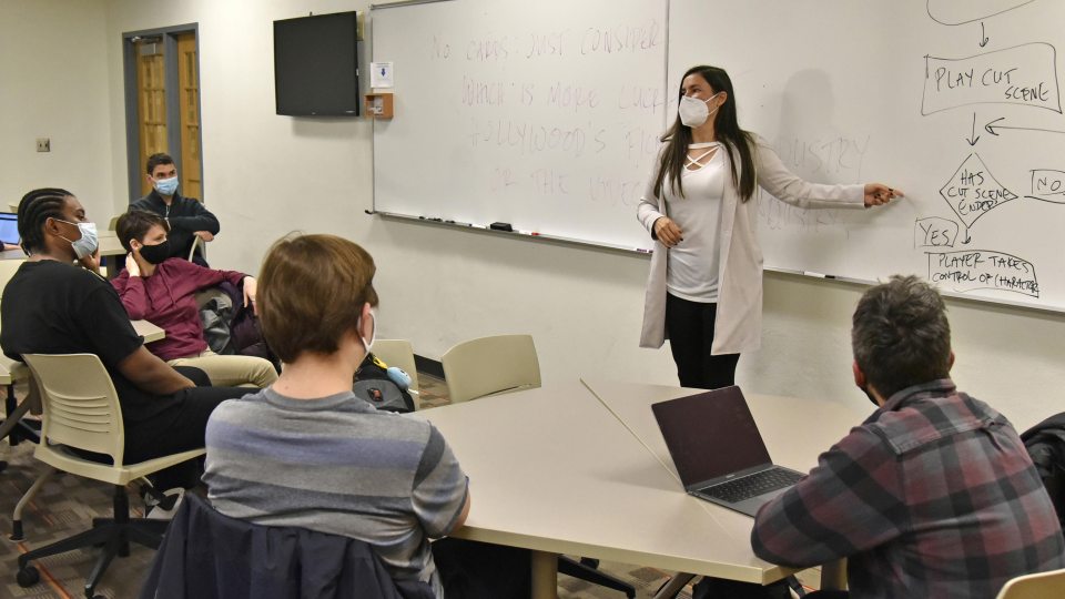 Faculty member Soma Mei Sheng Frazier works with students in her Creative Writing 313 class, which is part of the Subnivean literary magazine project.
