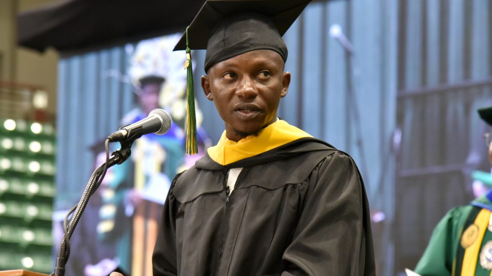 Otis Gbala is a December 2023 graduate in the master's in biomedical and health informatics program; here he speaks at December Commencement