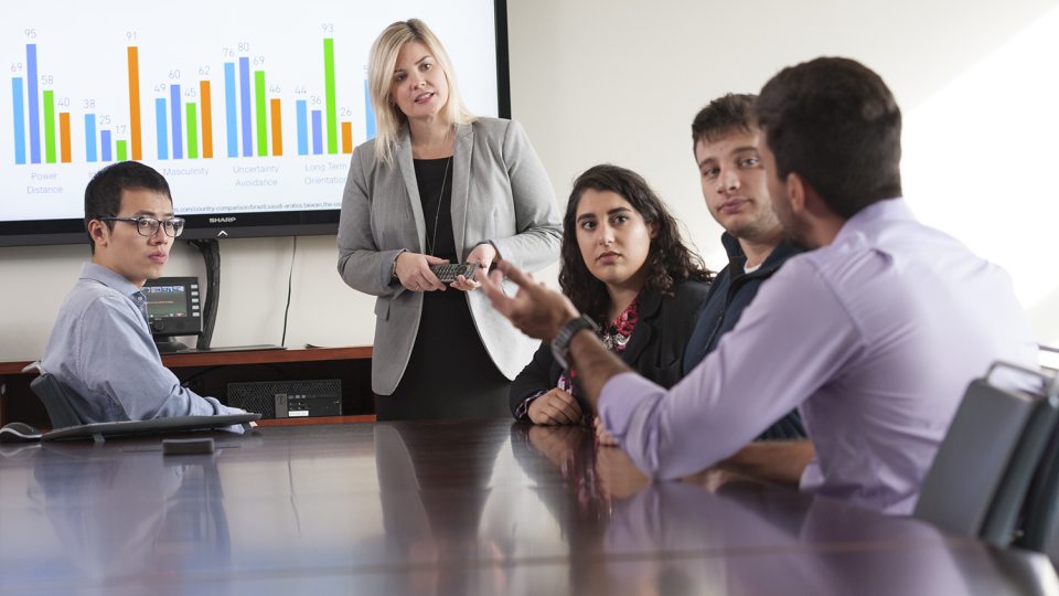 Dean Kristen Eichhorn speaks with graduate students