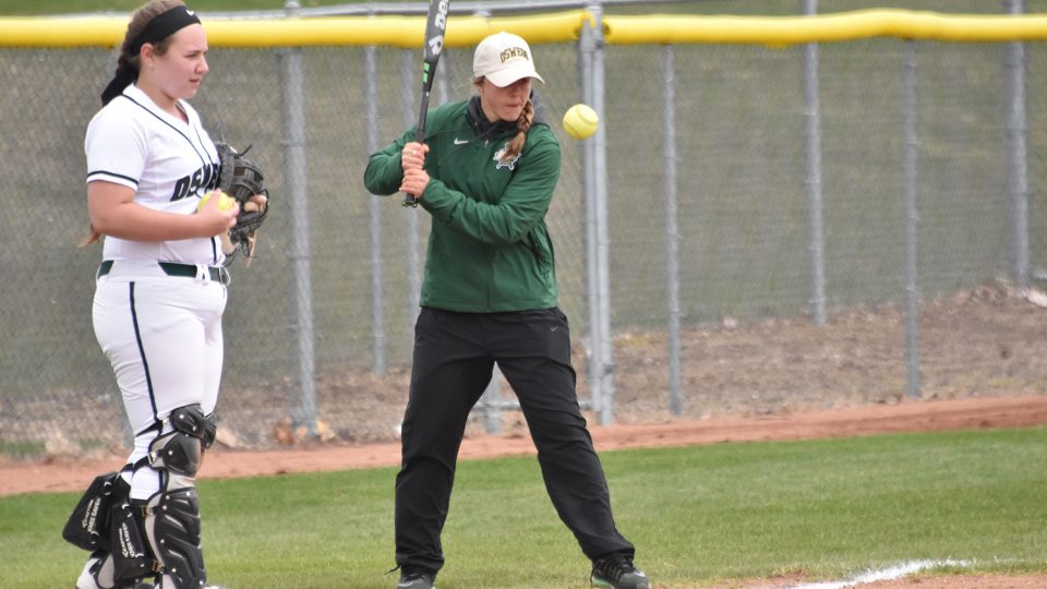Graduate student Morgan Nandin teaching softball