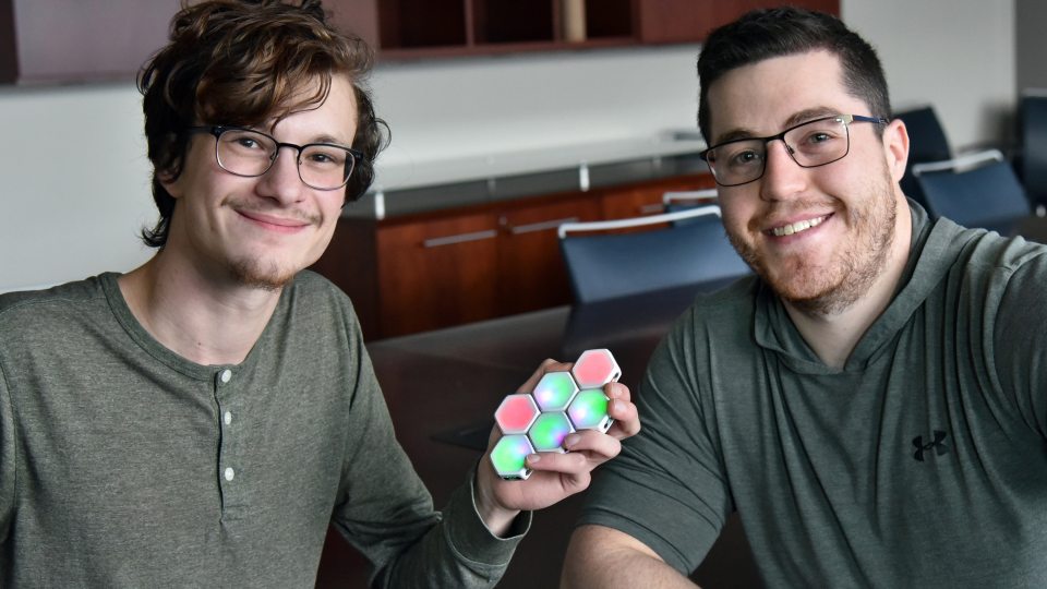 Ian Cummins and Theo Johnson with Blinks game pieces