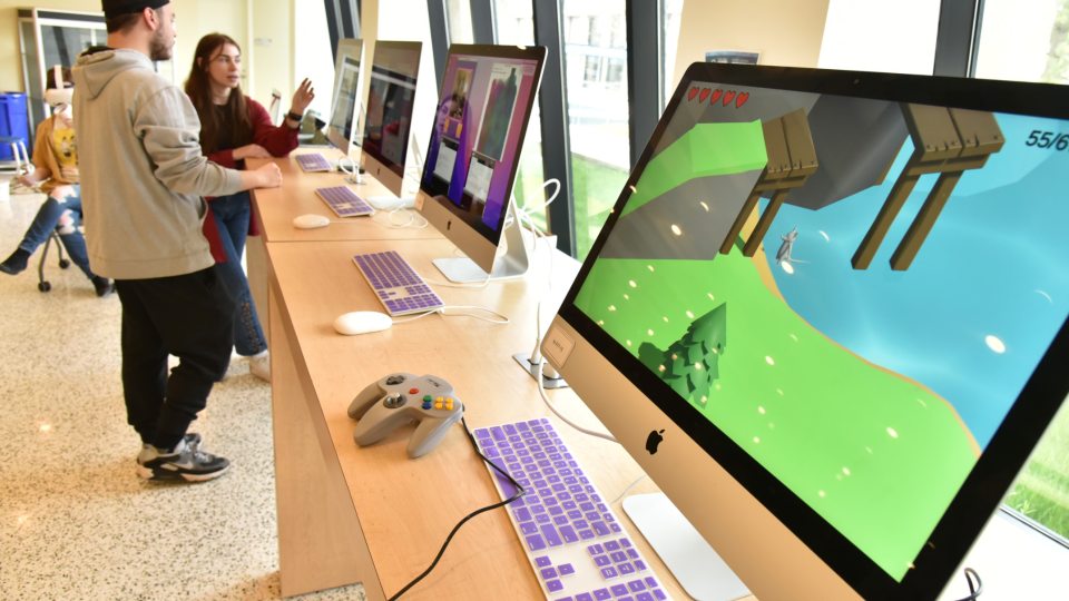 Large-screen computers display digital art projects