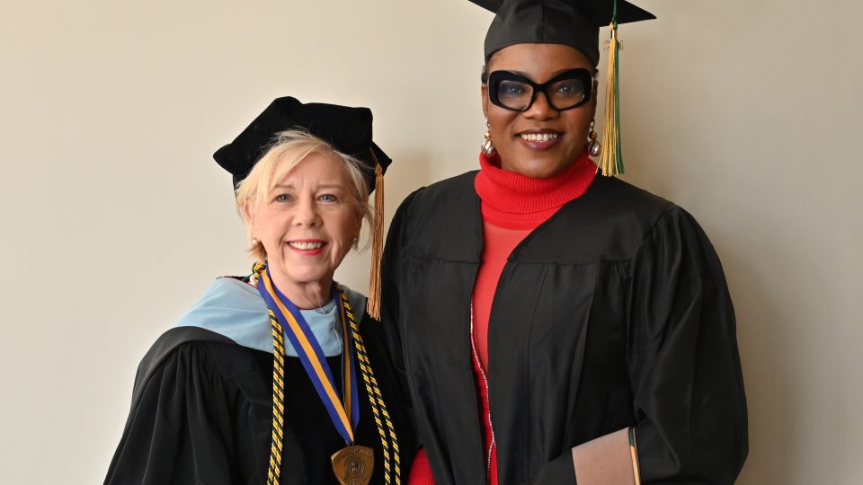 Irene Scruton, assistant dean of the School of Business and director of Oswego’s MBA programs, congratulates December 2024 online MBA graduate Jane Nwagu, the group head of business development for FBN Insurance Brokers in Lagos, Nigeria.