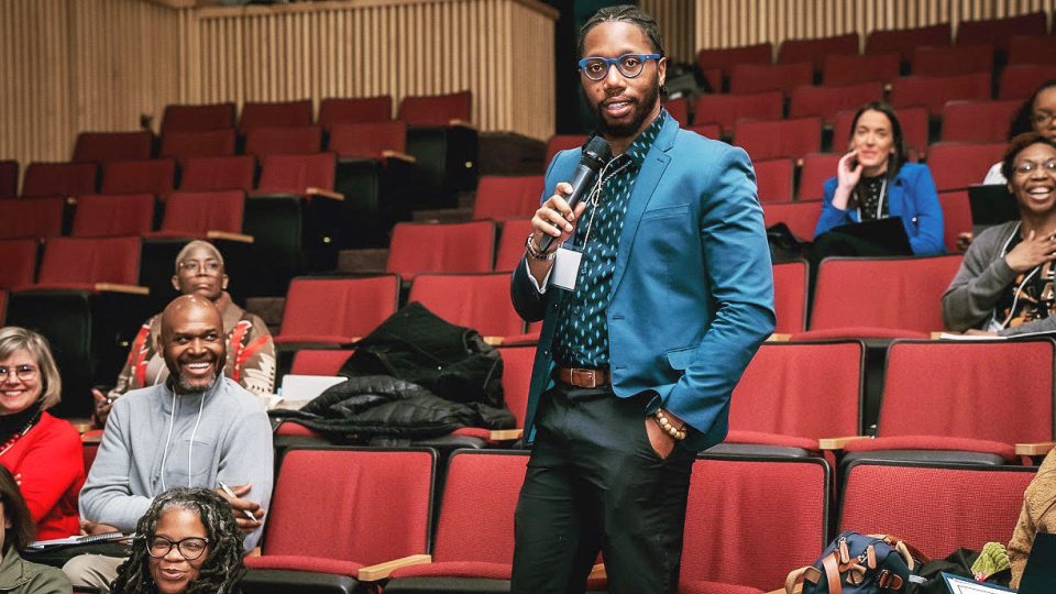 Issac McGee speaking at a conference