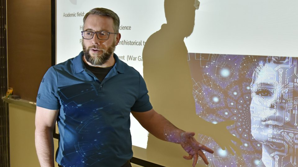 Jason Zenor teaching about futurism, connecting with his expertise on legal and ethical issues related to artificial intelligence