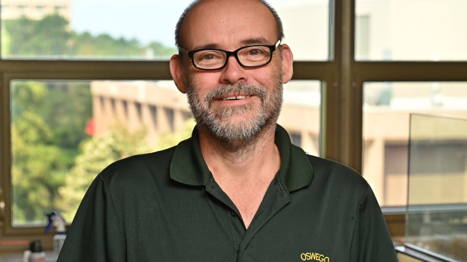 John-Jay Grass of the Student Accounts Office earned the Chancellor's Award for Excellence in Classified Service