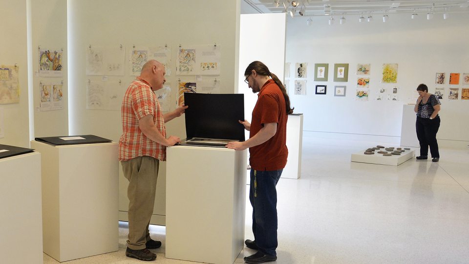 Gallery workers prepare Judith Ann Benedict art exhibition