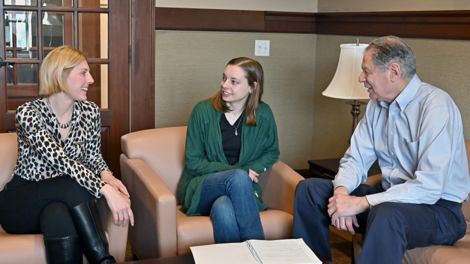 Kayla Hoyt (center), a senior human resource management major, is researching ways to mitigate and prevent microaggressions as part of her Quest research and senior honors thesis. Her advisors for the project are Kristin Sotak and Barry Friedman.