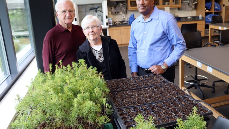 Arizona residents and New York state canal system boaters George and Jane Pauk join SUNY Oswego's Kamal Mohamed in a lab at Rice Creek Field Station