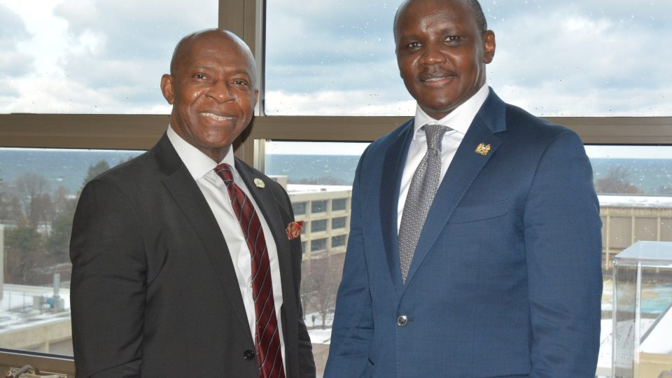 SUNY Oswego President Peter O. Nwosu (left) welcomes Kenyan Ambassador to the United Nations Erastus Ekitela Lokaale during a campus visit  in December 2024