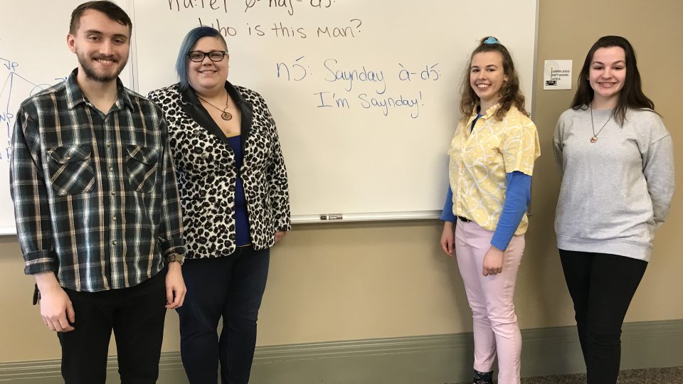 Faculty and students show off example of Kiowa language
