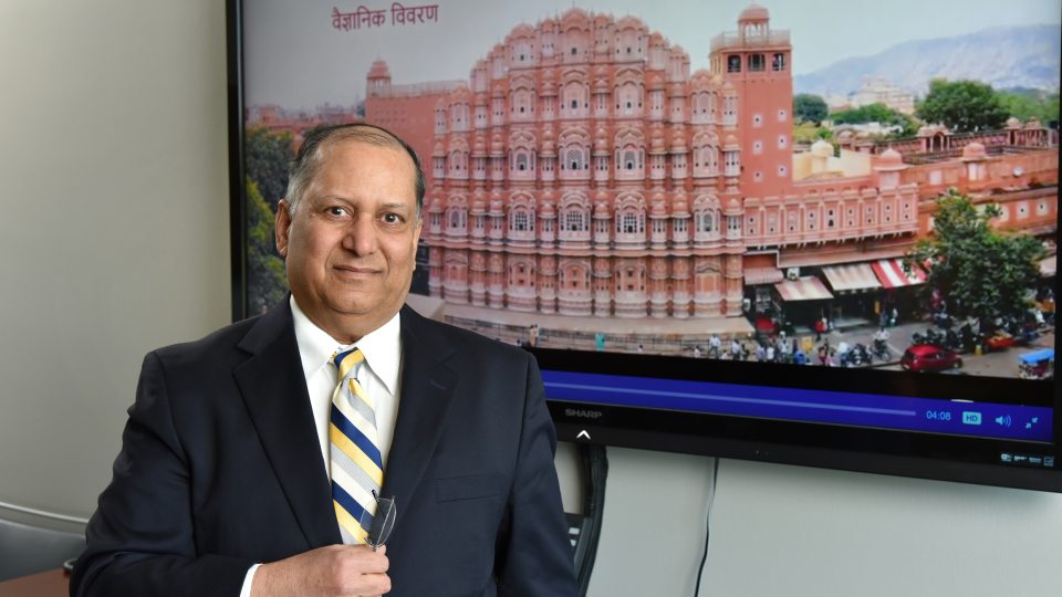 Alok Kumar with still of video he produced, this showing Hawa Mahal in Jaipur, a honeycomb structure built in 1799 that employs the Venturi effect for natural air conditioning