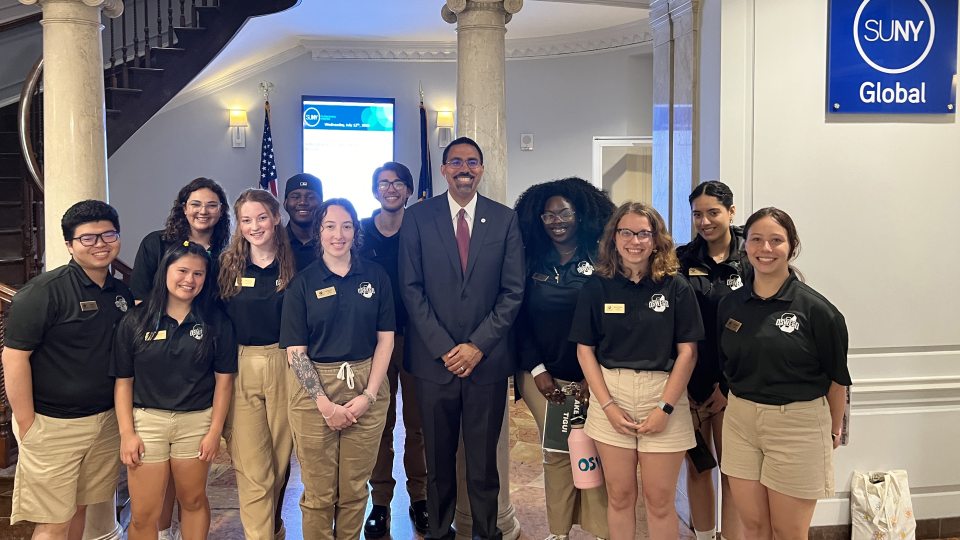 SUNY Chancellor John B. King Jr. visits with Laker Leaders student orientation guides during SUNY Oswego's inaugural Downstate Orientation Program this summer